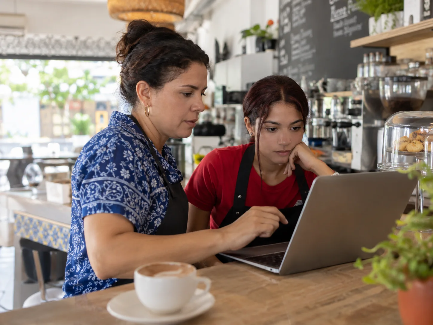 A local café team reviews a message before replying.