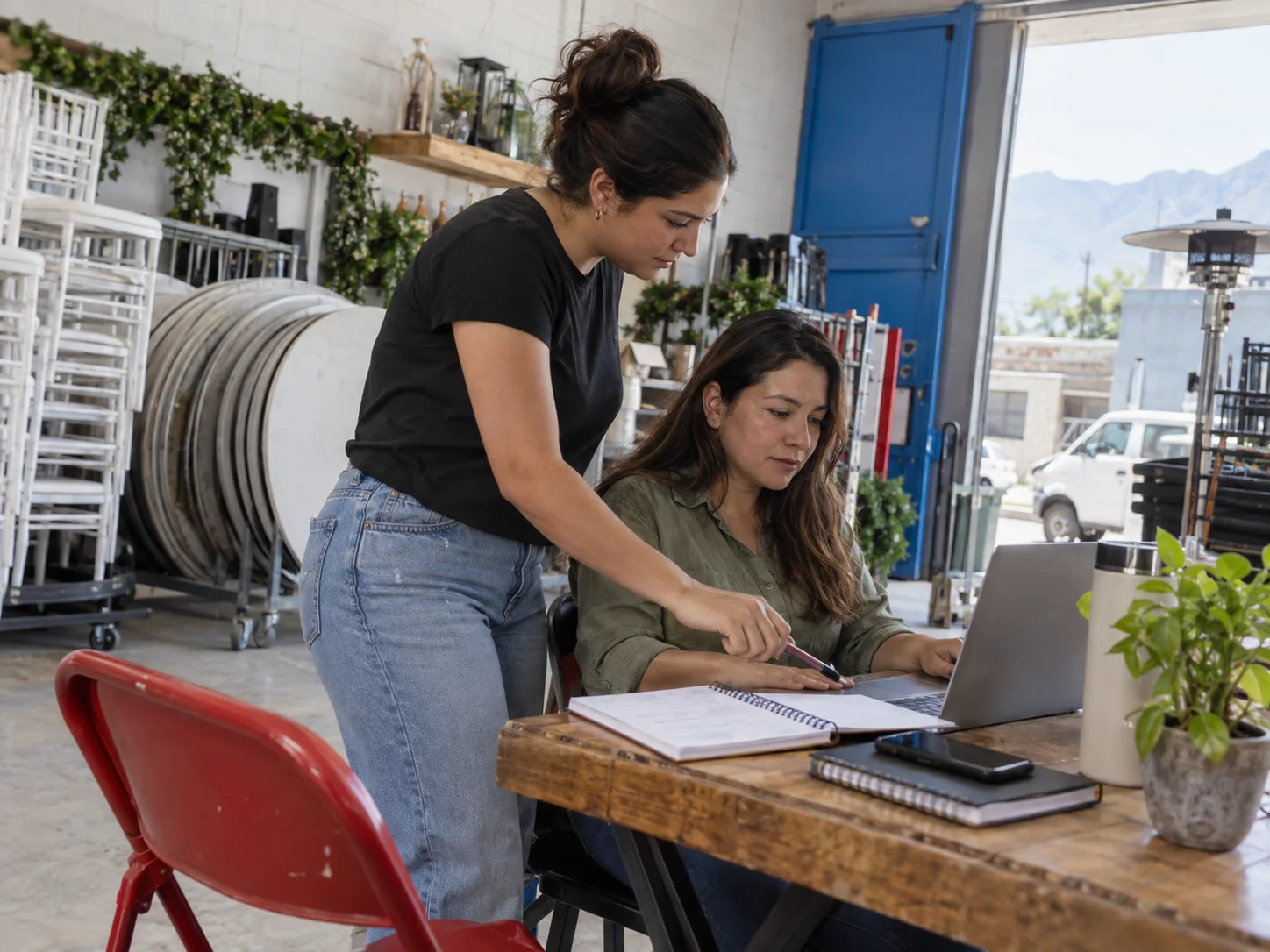 A small event-rental team prepares a customer reservation together.