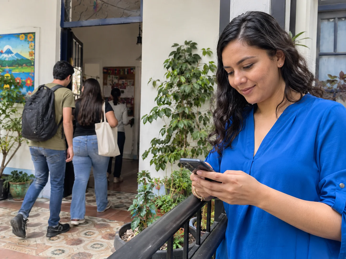 A language-school coordinator checks class messages on a break.